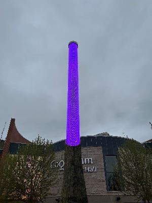 LED light column illuminated with purple and white.