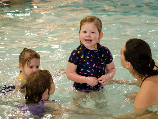 Smiling child in swimming lessons