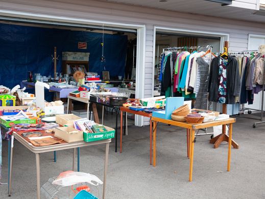 Carport with a wide variety of garage sale items for sale