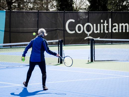 Individual practicing tennis
