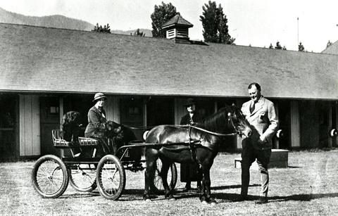 Eric and Alden Hamber outside the stables at Minnekhada (City of Coquitlam Archives, C6.3112)