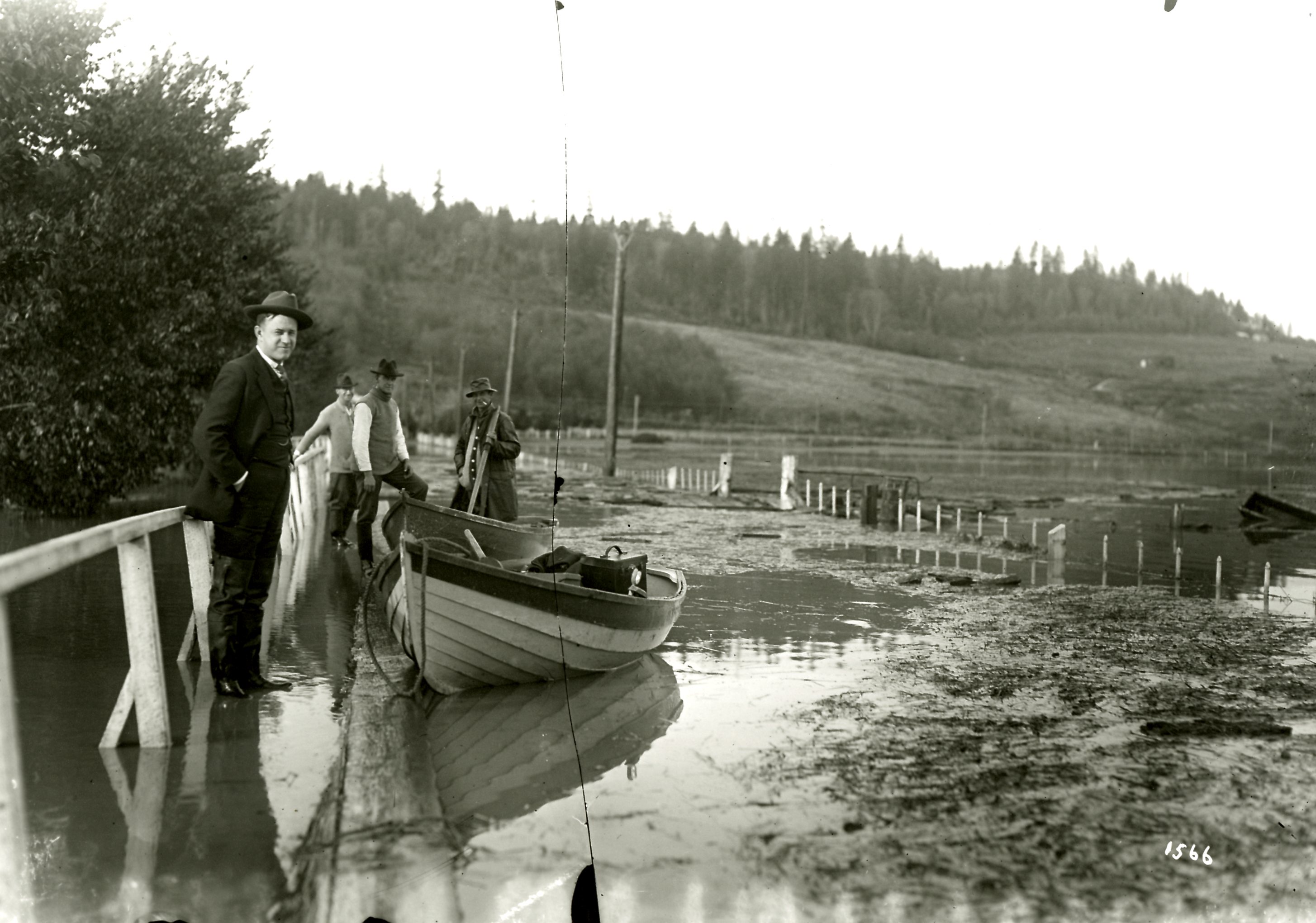 Broken Glass Plate Negative of a Man with a Boat During the Flood at Colony Farm, Circa 1921 (JPG) Opens in new window