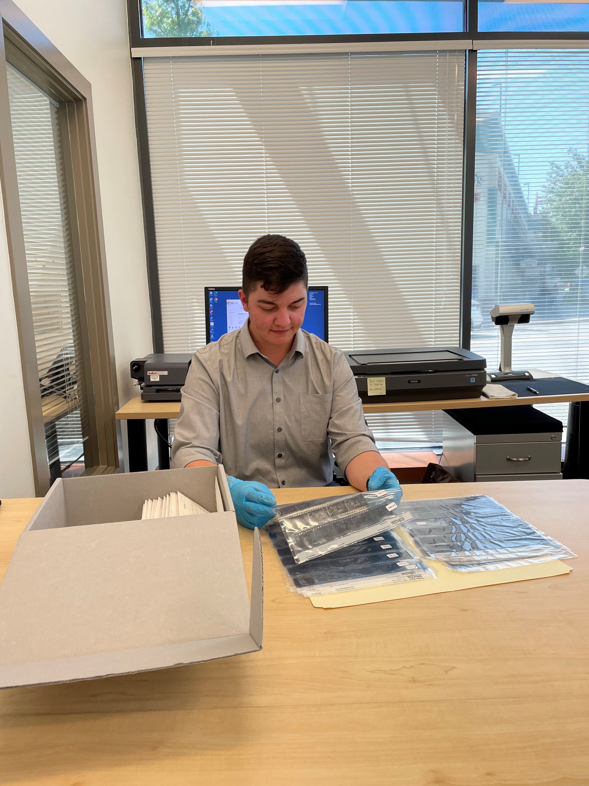 Malcolm Fish - student intern - working on digitizing TCN Negatives