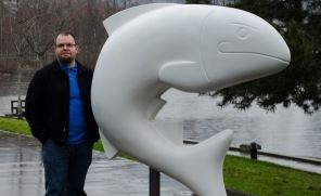 Artist Jody Broomfield with a salmon sculpture prior to it being painted